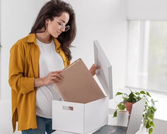 side-view-pregnant-woman-arranging-box-home